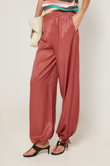 BRICK RED TAPERED HEM FLUID TROUSERS