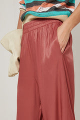 BRICK RED TAPERED HEM FLUID TROUSERS