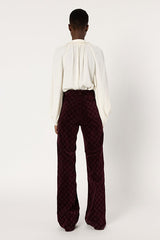 ANNA BURGUNDY MONOGRAM FLARED VELVET TROUSERS