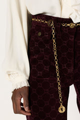 ANNA BURGUNDY MONOGRAM FLARED VELVET TROUSERS