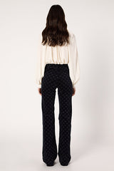 ANNA NAVY MONOGRAM FLARED VELVET TROUSERS
