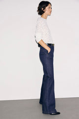 IVY FLARED RAW-DENIM JEANS